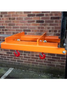 Orange forklift hook attachment with twin swivel lifting hooks for safe material handling and load transport.