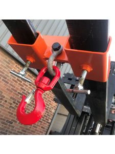 Close-up of forklift fork-mounted hook attachment with red lifting hook.