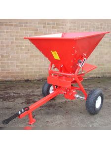 Red towable fertiliser spreader with large hopper and pneumatic wheels for efficient agricultural and grounds maintenance use.