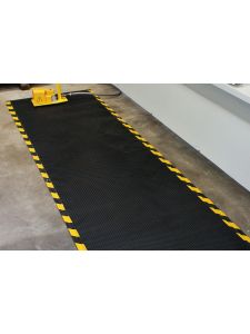 Industrial anti-fatigue mat with yellow safety border – slip-resistant cushioned floor mat for workplace safety.