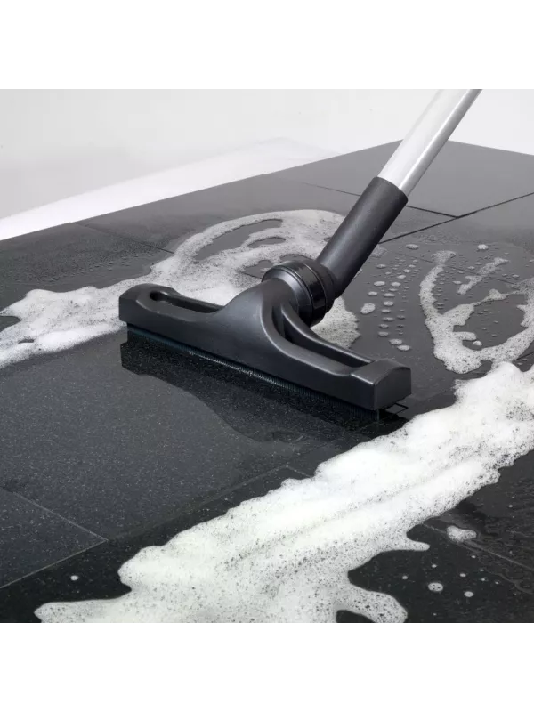 Floor tool cleaning soapy water from a surface.