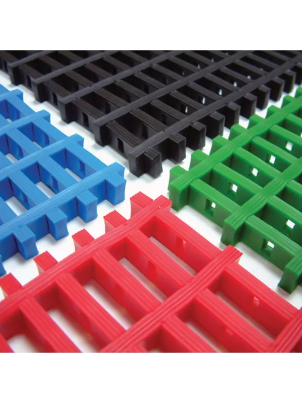 Interlocking modular floor mats in red, black, green and blue for workplace safety flooring.