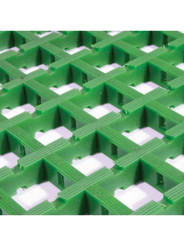 Green heavy-duty plastic floor grating with raised anti-slip surface and open drainage structure.