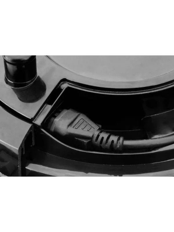 Close-up of the power switch and housing on a Numatic vacuum cleaner.