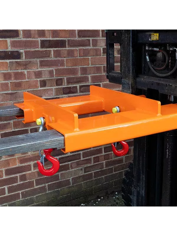 Heavy-duty forklift hook frame with dual lifting points securely mounted to forklift forks.