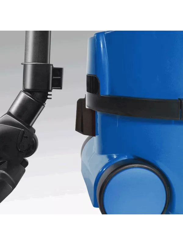Close-up of the hose and wand connection on a blue Numatic vacuum cleaner.