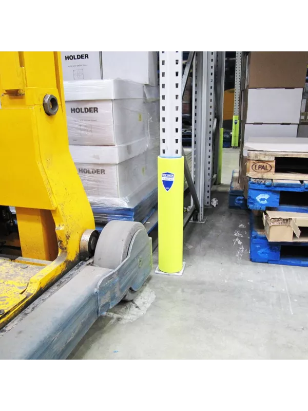 Forklift operating near a racking upright fitted with a yellow rack protector.