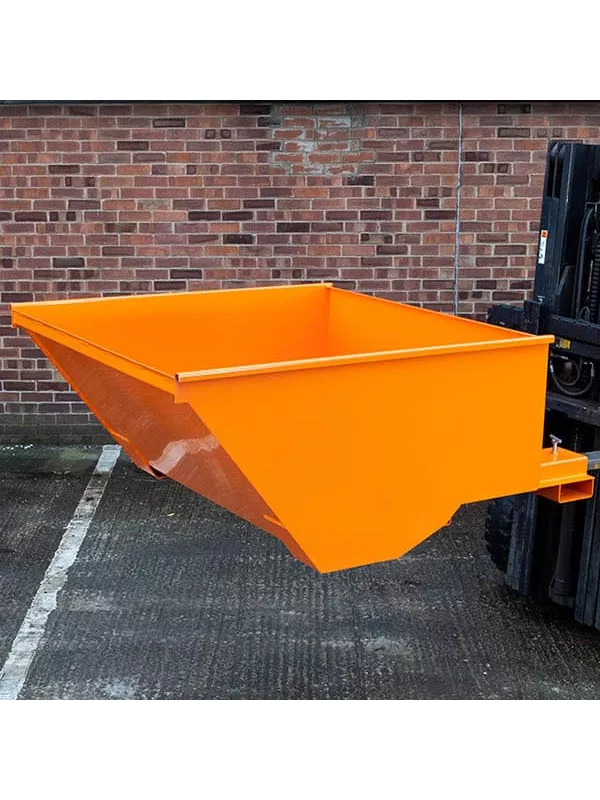 Side view of orange forklift tipping skip