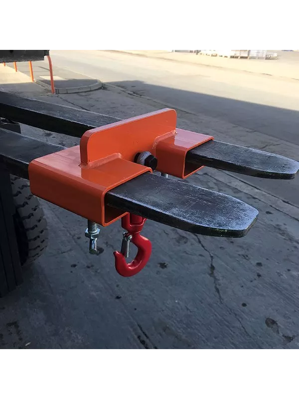 Forklift with orange fork-mounted hook attachment positioned for lifting.