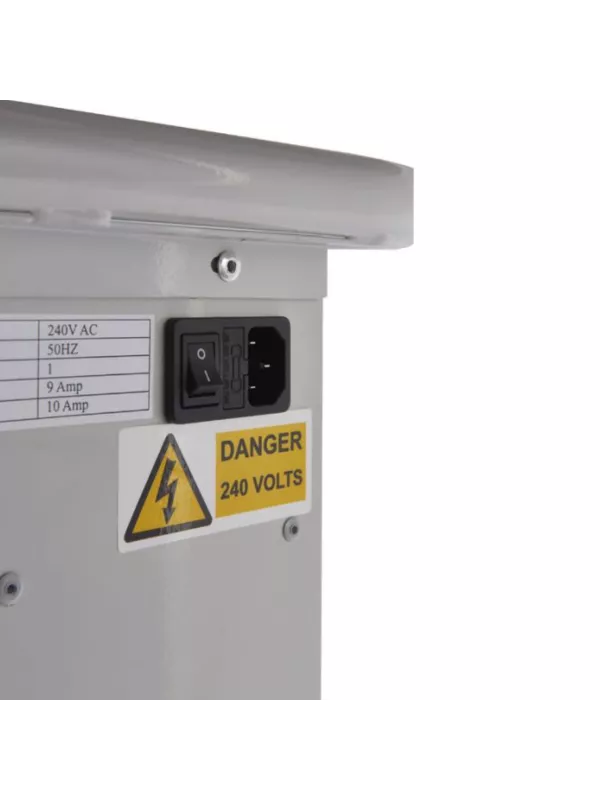 Electrical power inlet with safety warning label on device charging trolley.