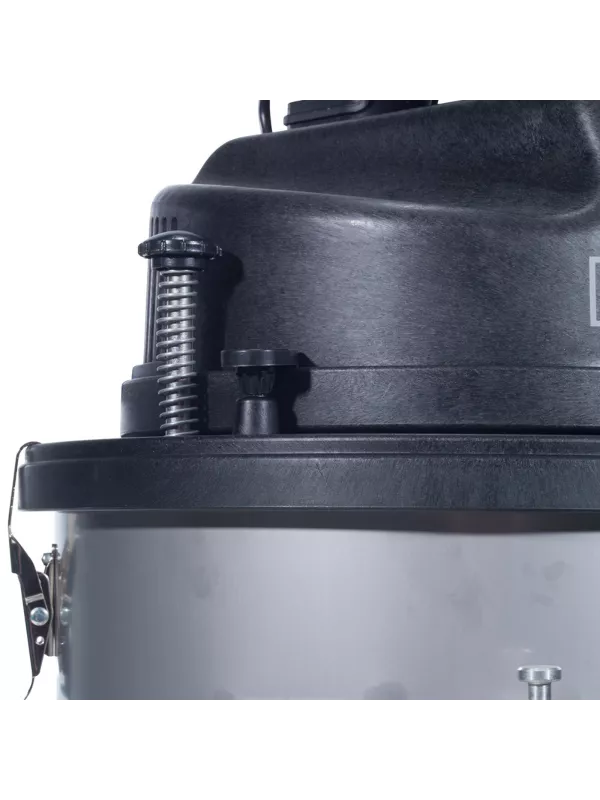 Close-up of the vacuum cleaner lid and motor housing showing detail of the top components.