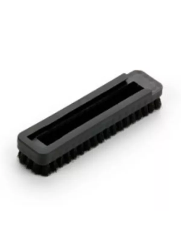 Rectangular vacuum brush attachment with stiff bristles.
