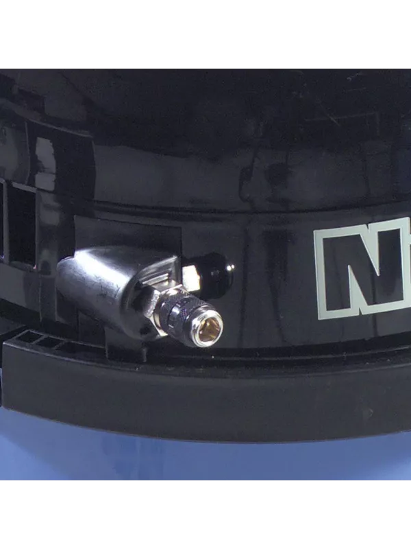 Close-up of the spray solution outlet fitting on a Numatic extractor.