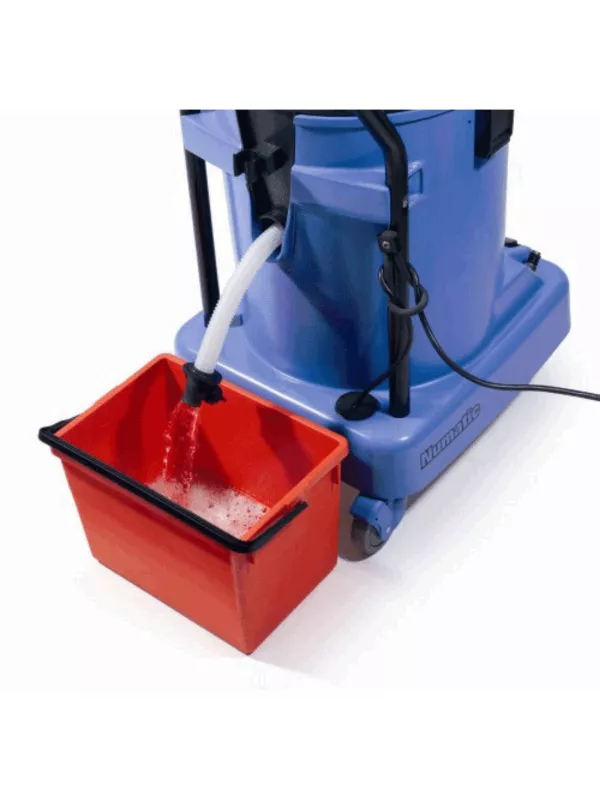 Numatic extractor draining into a red bucket using the built-in hose.