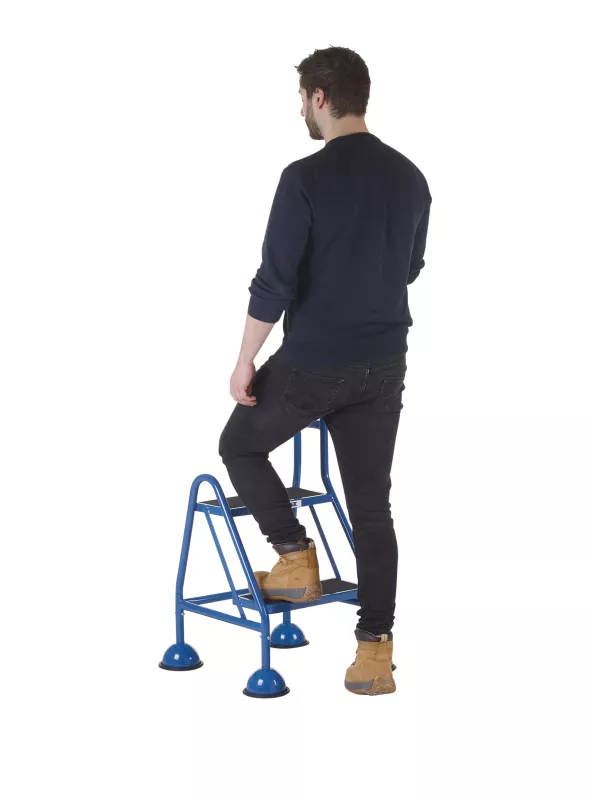 Man using two-step safety stool with back handrail