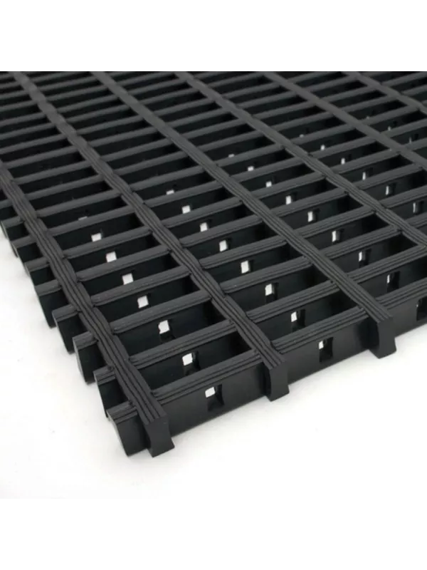 Black interlocking industrial floor mat with raised grid structure for wet or oily areas.