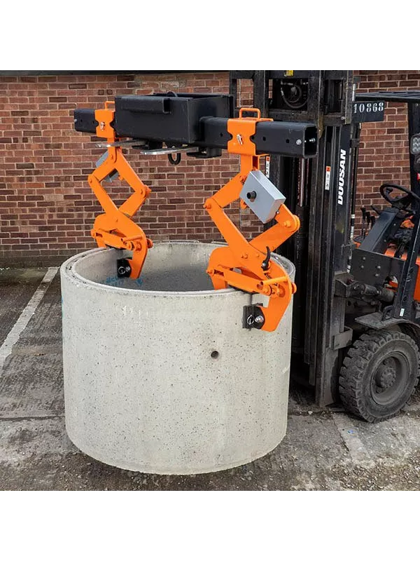 Forklift lifting concrete pipe using orange mechanical pipe grab attachment.