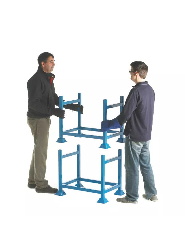 Adjustable steel stillage system being assembled by operators