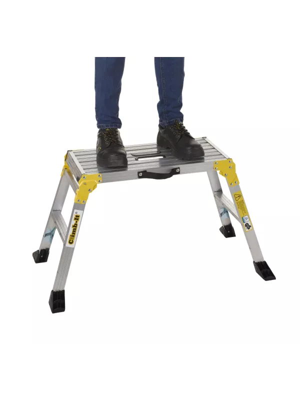 Two people standing on aluminium work platform with yellow safety legs.