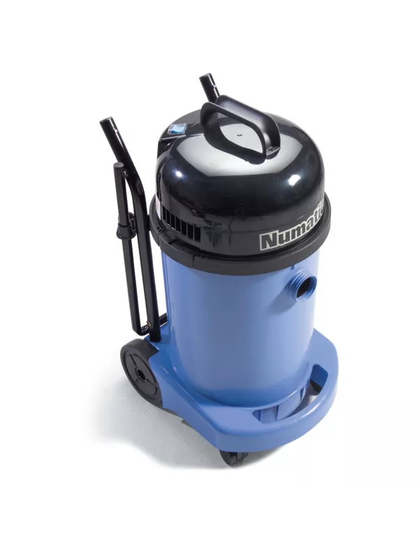 Numatic vacuum cleaner with trolley frame shown in a tilted position for emptying.
