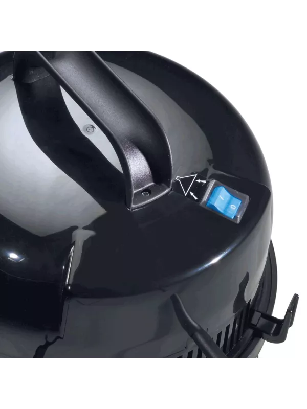 Close-up of the top handle and power switch on a Numatic vacuum cleaner.