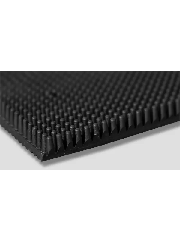 Close-up of textured surface on black entrance mat – durable anti-slip floor matting for commercial use.