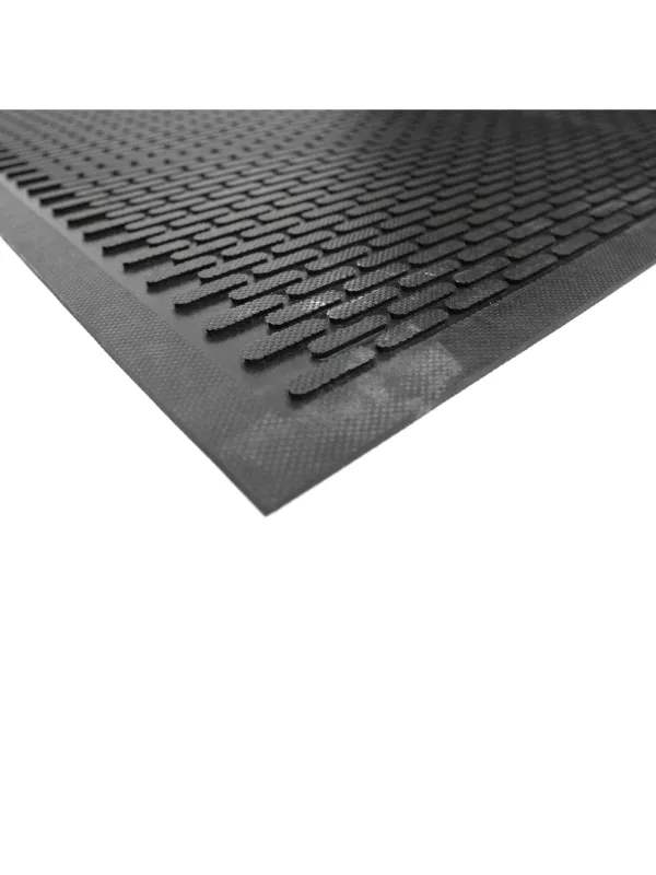 Detailed view of interlocking-style raised surface on industrial anti-fatigue rubber flooring.