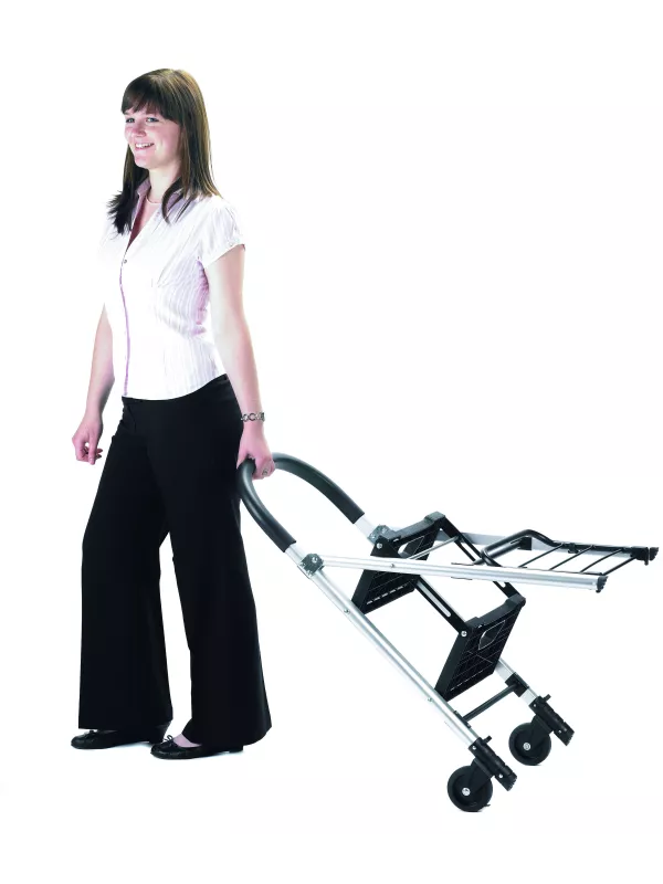 Person pulling folding aluminium sack truck in partially collapsed position.