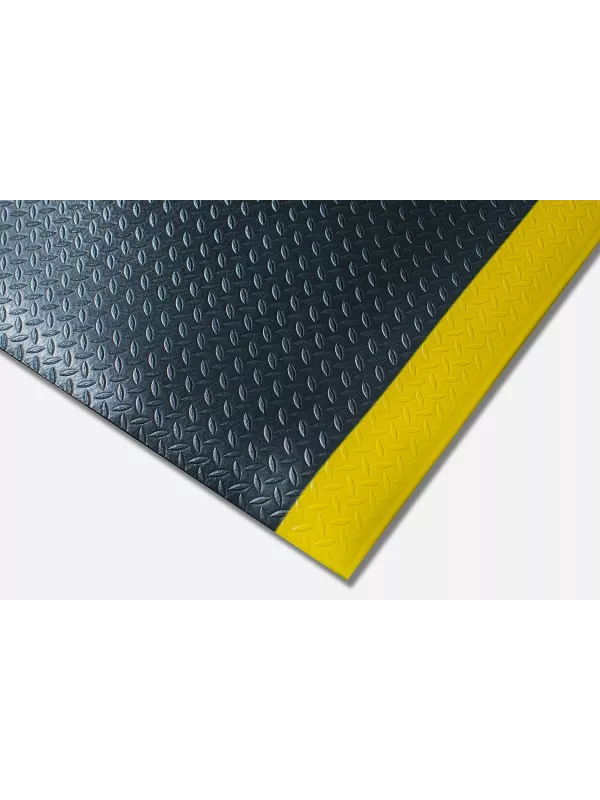 Anti-fatigue mat with textured surface and yellow safety edge – durable cushioned workplace floor mat.
