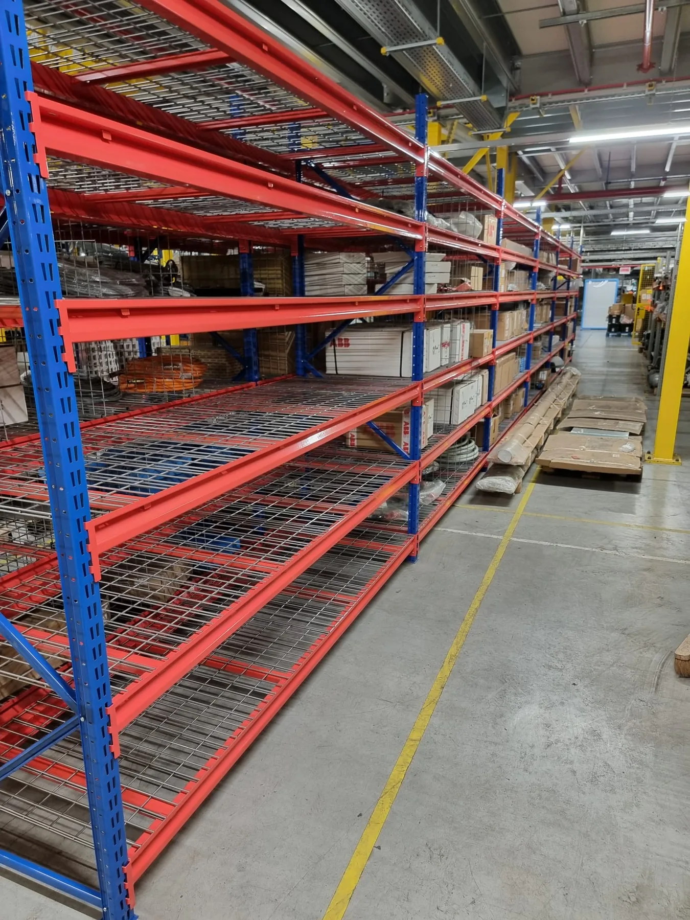 ANCO TS Longspan racking with wire mesh decking in a working industrial storage area