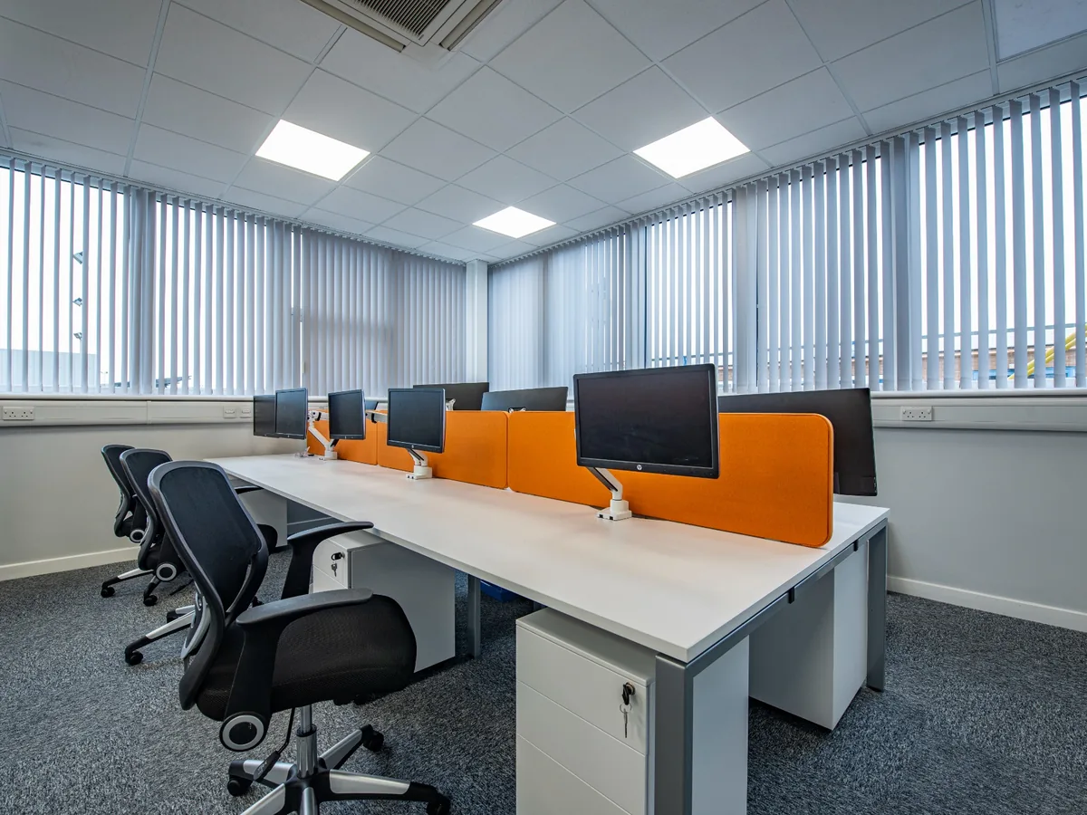 Modern office furniture including desks and task seating