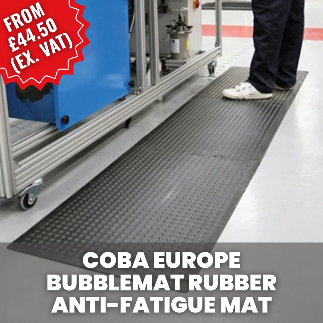 Worker standing on a COBA Bubblemat rubber anti-fatigue mat at a production workstation, designed to reduce fatigue and improve comfort during standing tasks.