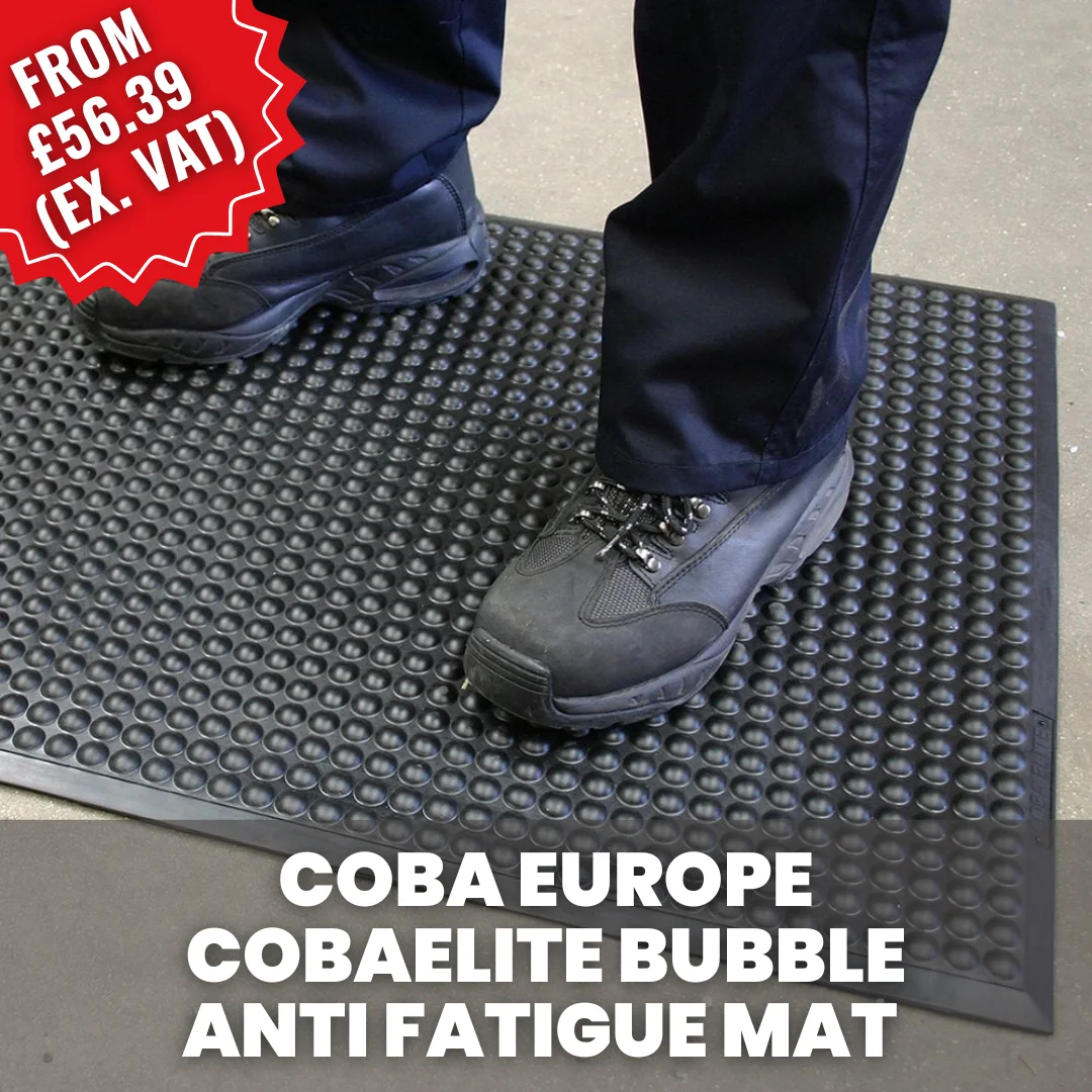 Worker standing on a COBA Cobaelite bubble anti-fatigue mat in an industrial environment, designed to reduce standing fatigue and improve comfort.